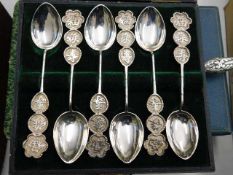 A set of six Chinese white metal spoons twinned wi
