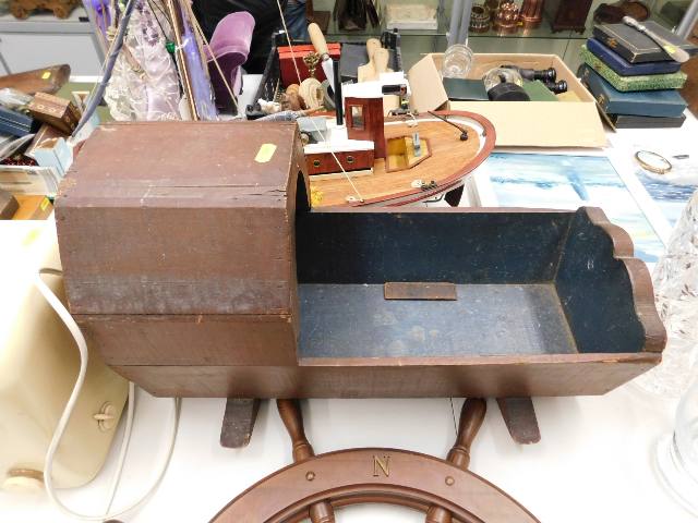 A vintage childs doll cradle