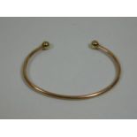 A 9ct gold bangle 8.5g