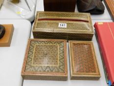 Three decorative inlaid Islamic boxes