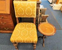 An antique upholstered oak chair twinned with mode