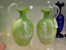 A pair of lime coloured satin glass Mary Gregory j