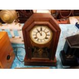 A wooden cased mantle clock