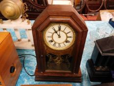 A wooden cased mantle clock