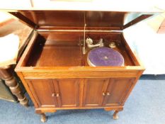 A vintage gramophone in mahogany cabinet