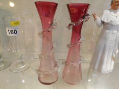 A pair of cranberry vases, some chips to rim on on