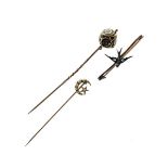 Unmarked yellow metal mourning stickpin, another stickpin set diamond and seed pearls and a bar