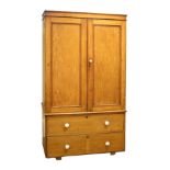 Victorian pine linen press, the upper section fitted two panelled doors opening to reveal a