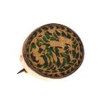 Gold coloured metal oval green foil backed brooch decorated with a hunting scene Condition: