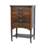 Edwardian walnut music chest fitted five fall front drawers, platform below and standing on square