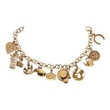 9ct gold and yellow metal charm bracelet, 21.7g approx gross Condition: