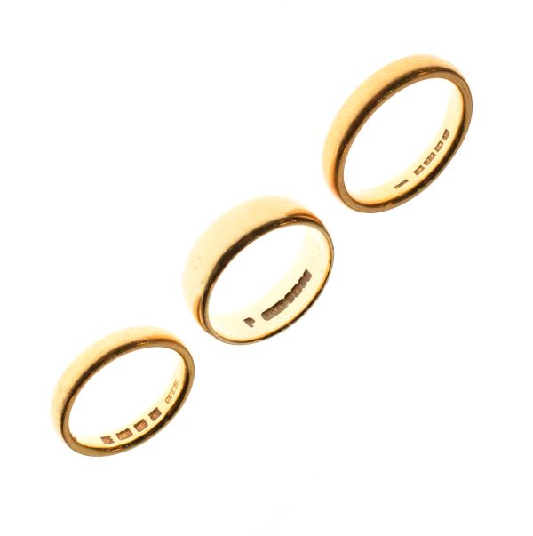 Two 22ct gold wedding bands, sizes L and P, combined weight 14.4g approx, together with an 18ct gold