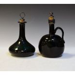 19th Century green glass baluster shaped decanter, together with a somewhat similar carafe, each