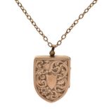 Engraved unmarked yellow metal shield shaped locket with neck chain Condition: