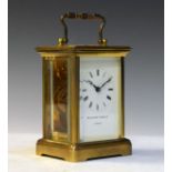 Modern brass cased carriage clock, the white enamel dial with Roman numerals Condition: