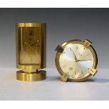 Mid 20th Century Swiza gilt brass cased cylindrical alarm clock, together with a similar circular