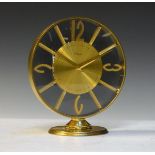 Mid 20th Century Imhof gilt brass cased circular mantel clock, the transparent dial having a