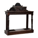Late 19th/early 20th Century heavily carved oak hall/stickstand fitted a central drawer and standing