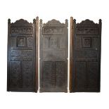 19th Century heavily carved oak three fold screen, the panels with Neo-classical decoration and