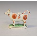 19th Century Staffordshire pottery cow creamer having red patch decoration Condition: