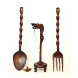 Chinese carved wooden dragon from lamp, carved wooden ornamental outsize spoon and fork and a roller