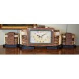 Art Deco design onyx marble and slate cased garniture de cheminee, the clock dial with Arabic