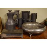 Set of seven French pewter graduated measures, similar jug, pair of pewter candlesticks, hammered