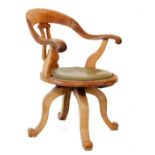 Late 19th Century tub shaped swivel desk chair having a vase shaped back splat, upholstered seat and