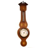 Inlaid mahogany cased aneroid barometer and thermometer having a silvered dial and scale Condition: