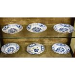 Five matching early 20th Century Meissen plates, each having blue and white foliate decoration