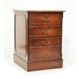 Reproduction style mahogany two drawer filing cabinet having an inset leather top and standing on
