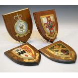 Royal Air Force emblem on a wooden shield, similar Machine Gun Corps piece and two others Condition: