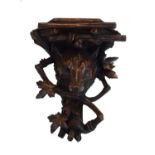 Black Forest carved wooden wall bracket decorated with the head of a wolf Condition: