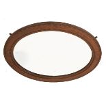 Early 20th Century oak framed oval bevelled wall mirror Condition: