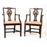 Pair of 19th Century mahogany open arm elbow chairs, each having a pierced back splat, drop-in