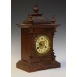 Early 20th Century bronze brass mount oak architectural style mantel clock, the brass dial having an