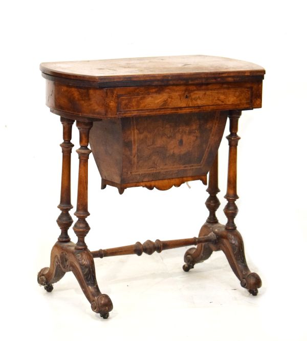 Victorian string inlaid and crossbanded figured walnut games/work table, the fold over top opening