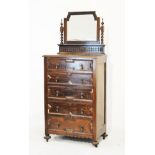 1920's period oak Jacobean Revival dressing chest, the raised back fitted bevelled swing mirror on