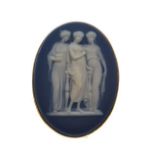 Yellow metal mounted oval Wedgwood jasperware brooch decorated with the three graces, the mount