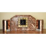 Art Deco design marble and slate garniture de cheminee, the clock dial with Arabic numerals, width