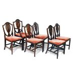 Six Georgian style mahogany shield back dining chairs, each having a drop-in seat and standing on