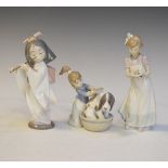 Three Lladro figures - Bashful Bather, Playing The Flute and Happy Birthday Condition: