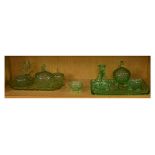 Two 1930's period green moulded glass dressing table sets Condition: