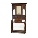 Early 20th Century heavily carved oak mirror back hallstand fitted one drawer and standing on