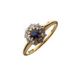 Yellow metal ring set diamonds and sapphire coloured stones, the shank stamped 18ct, size k, 2.6g