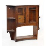 Edwardian walnut smokers cabinet fitted two glazed doors enclosing a fitted interior, open shelves