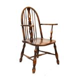 Beech and elm Windsor style open arm elbow chair standing on splayed turned supports united by