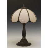 Reproduction bronzed metal table lamp having a mottled pink shade Condition: