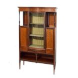 Edwardian inlaid mahogany display cabinet fitted three shelves enclosed by a bowed glass door,