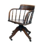 Early 20th Century Smokers Bow type beech, ash and elm swivel desk chair Condition: